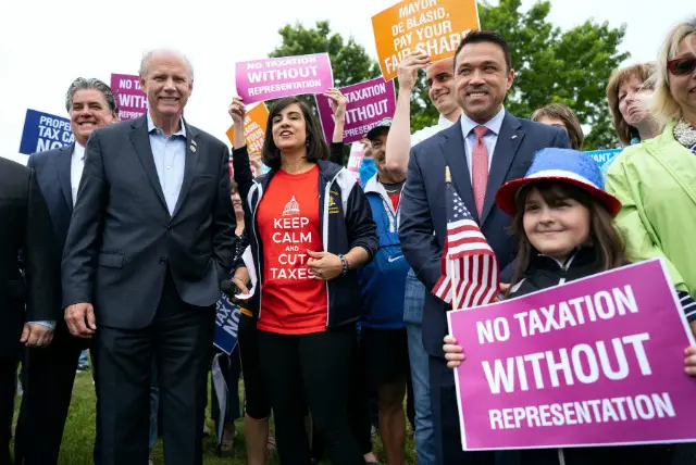 Rep. Dan Donovan and former Rep. Michael Grimm, attend a property tax protest rally in Staten Island
